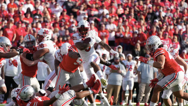 Utah Utes running back TJ Pledger (5) carries the ball against the Ohio State Buckeyes during the 2022 Rose Bowl at Rose Bowl. Ohio State defeated Utah 48-45.